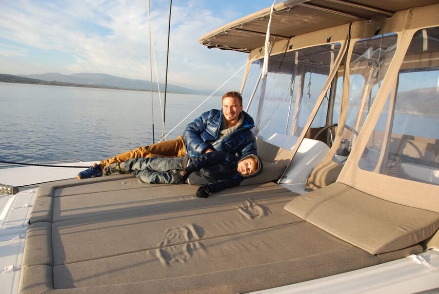 Tromsø: Fjord and Islands Luxury Catamaran Cruise - Panorama Saloon, deck day beds, and thermal suits that actually help