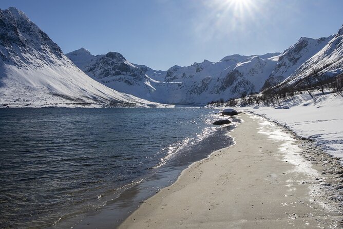 Tromso fjords road trip with fire in grill cabin by the beach. - Stop 1: Grotfjord’s white sand beach under Grøtfjord mountains