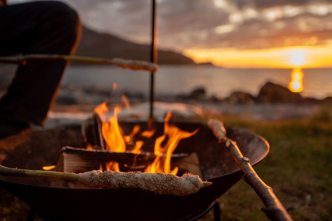Tromsø: Midnight Sun with Campfire with Wandering Owl - Grotfjord beach camp: bonfire dinner, bread-making, and summer light